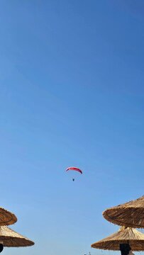 paragliding in the blue sky