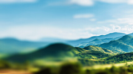 Obraz premium 山並みと青空が雄大に広がる夏の新緑風景背景