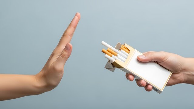 Cigarette pack offer being refused by a hand gesture showing a clear stop sign signal