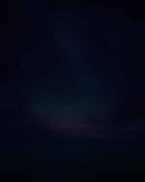 Dark blue night sky background with soft clouds
