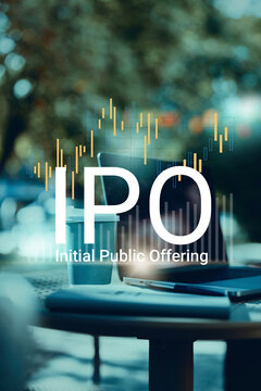 IPO marks initial public offering process with charts and data on a laptop in a coffee shop setting