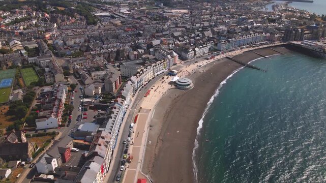 Aberystwyth seafront beach promenade bandstand and pier aerial drone view