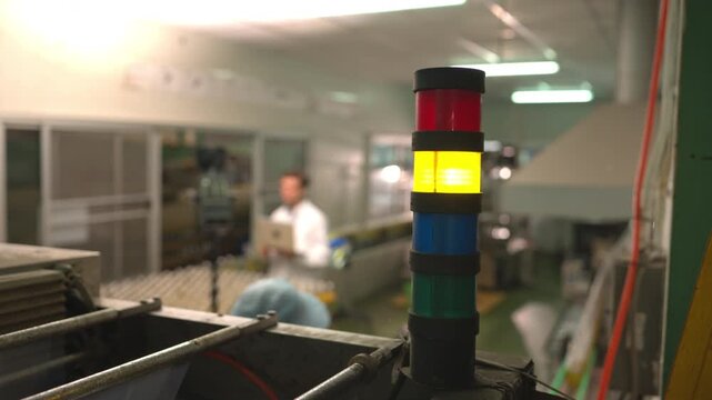Status indicator lights used for monitoring and controlling processes in large-scale bottled beverage production lines