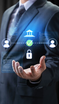 Businessman displaying holographic icons of a bank, lock, and user connections, representing secure online transactions and cybersecurity