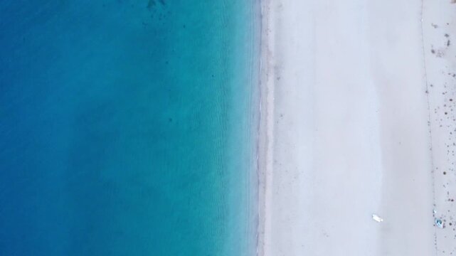 Aerial drone view of Los Muertos Beach in Cabo de Gata with turquoise water and white sand in Almeria, Spain