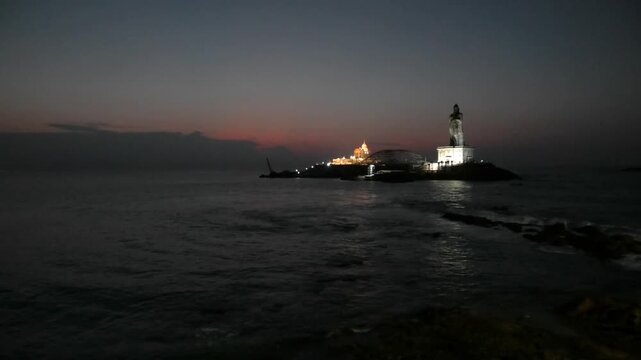 The early morning view of illuminated Vivekananda Rock Memorial and nearby structures from the mainland | Kanyakumari, Tamil Nadu, India