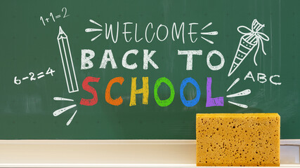 Welcome back to school greeting card with text - Green chalkbaord blackboard with chalk font and education symbols © Corri Seizinger