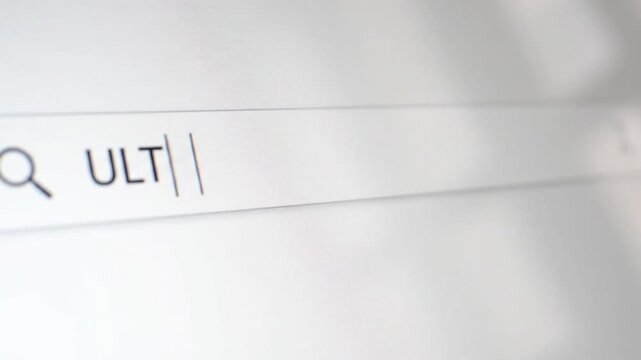 Search bar displaying the word 'ULT' being typed into a search engine on a computer screen, with focus on the input field