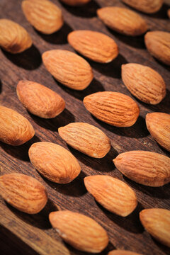 Raw Almonds on Wood Surface - Natural Nuts and Healthy Snack Ingredients