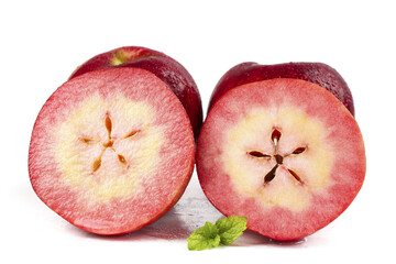 Red-Fleshed Xinjiang Apples Cut in Half Showing Pink Interior with Star Pattern © KieuThi