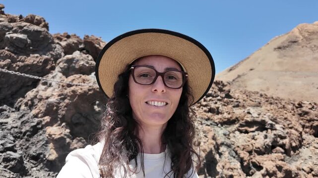 Woman pointing at Mount Teide during Tenerife vacation