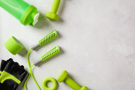 Green gym gear and shaker bottle with copy space right