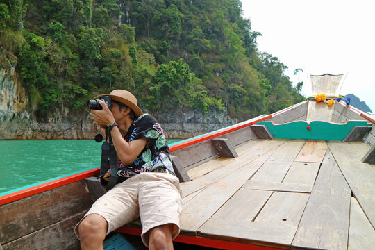 Traveler Capturing Amazing View of Cheow Lan Lake or Ratchaprapa Dam in Khao Sok National Park, Surat Thani, Thailand