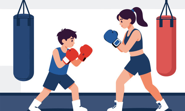 Professional female boxing trainer practicing punches with a young boy wearing boxing gloves in a gym.