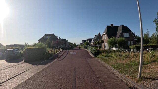 Epic travel footage of cycling through a modern Dutch neighborhood showcasing world-famous bicycle infrastructure and sustainable urban living