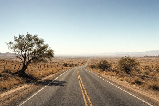 Lonely road winding through a vast desert landscape