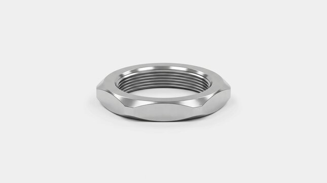 Shiny silver metal lock nut featuring internal threading resting on a clean plain white studio background