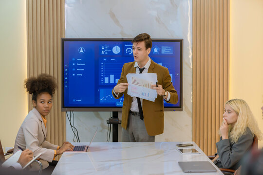 Diverse colleagues gather in brainstorm discuss statistics together. Group of people colleagues gather doing Brainstorming business plan together. Team Brainstorm Working Concept.