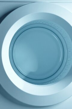 Clean Appliance Interior Detail A Close-Up View of a Smooth, Pale Blue Washing Machine Drum