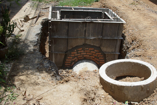Steel formwork for constructing concrete foundations for drainage pipes.