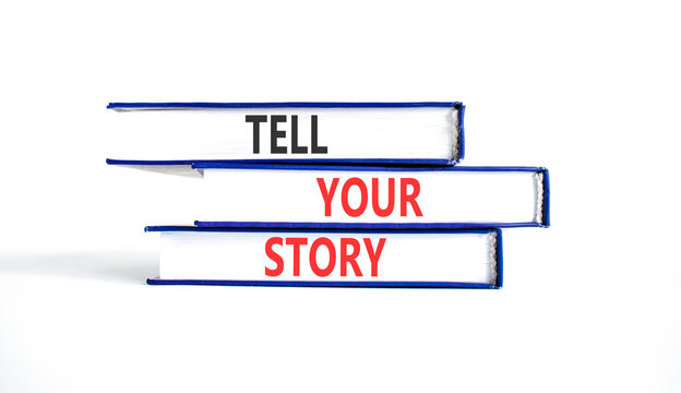 Tell your story symbol. Concept word Tell your story on beautiful books. Beautiful white background. Business tell your story concept. Copy space.
