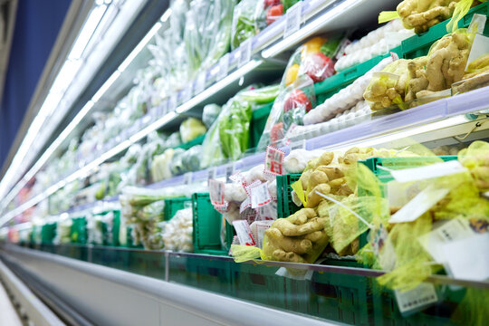 Fresh vegetables in refrigerated supermarket produce aisle