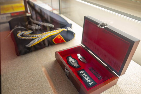 Police Wings Badge and Sealed Evidence Box with Officer Insignia