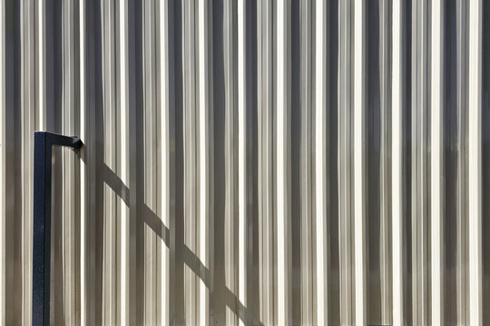 Industrial Corrugated Metal Texture with Cinematic Shadow for Premium Product Display.