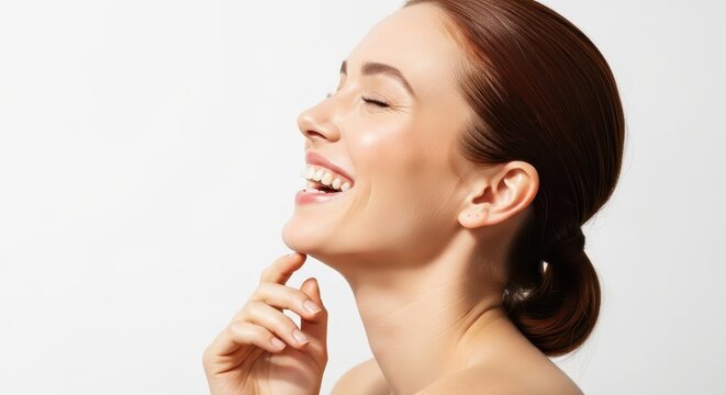 Beautiful Young Woman with Radiant Smile and Perfect Skin Isolated on White Background for Beauty and Skincare Concept