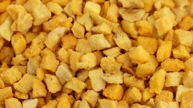 Yellow freeze dried mango slices texture circle rotation close up top view
