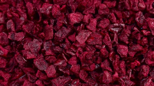 Red freeze dried cherry slices texture circle rotation close up top view