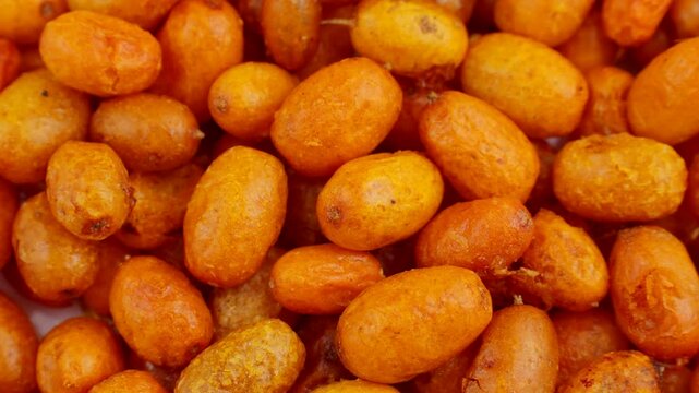 Organic orange freeze dried sea buckthorn berries circle rotation close up