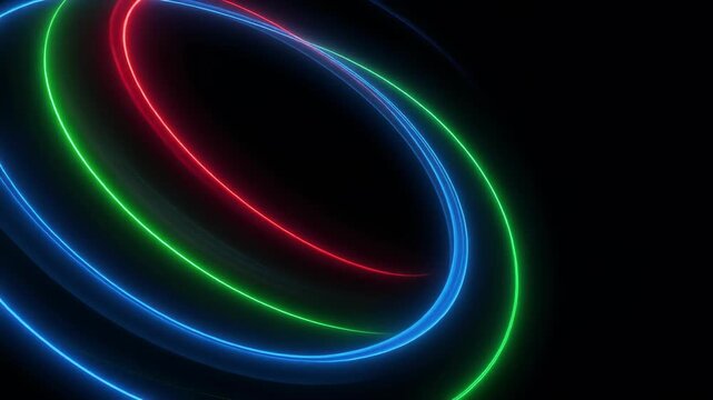 Colorful glowing neon rings in blue red and green on black background abstract light design