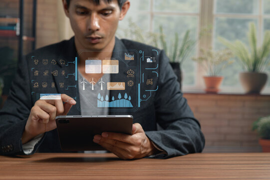 Business Professional Analyzing Digital Data and Graphs on Tablet in Office
