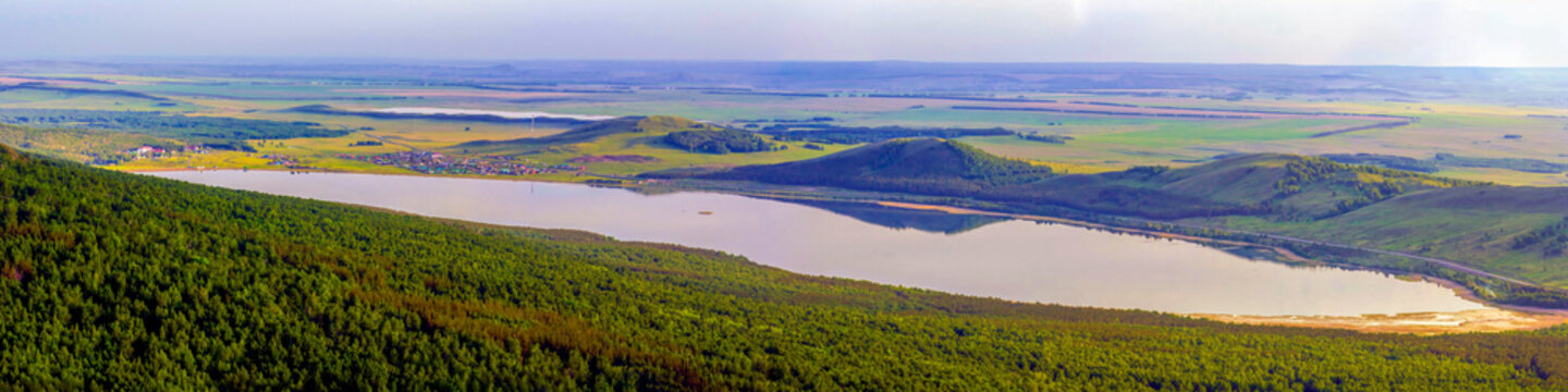 Alpine lake talkas against the backdrop of the Irendyk ridge of the Southern Urals in the Republic of Bashkortostan. Isyanovo village