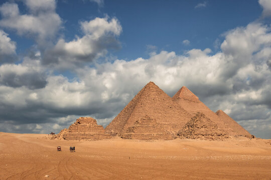 Sphinx and Giza Pyramids on a cloudy day - Cairo, Egypt
