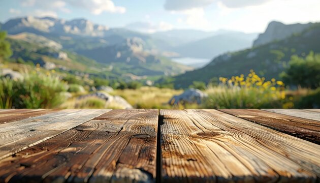 Empty wooden table with scenic mountain landscape background.
