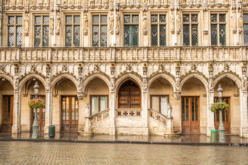 Fototapeta premium Symmetrical view of an ornate historic facade featuring Gothic arches and architectural details.