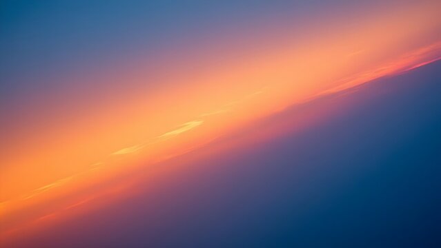 Vibrant sunset sky with streaks of orange clouds against deep blue background with displays colorful gradient orange blue hues cloudy sky orange pink