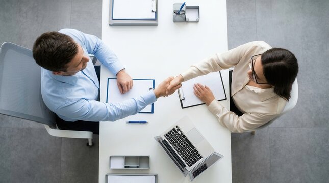 Business job recruitment process with a handshake between HR and candidate.