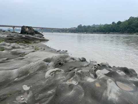 serene riverbanks and exposed bedrock of the beas River near nadaun himachal pradesh india 301