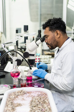 Male scientist analyzing samples researching in laboratory
