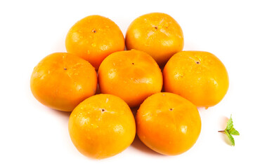 Fresh Orange Persimmons from Gongcheng Guangxi China Arranged in Heart Shape with Mint Leaf © Nguyen