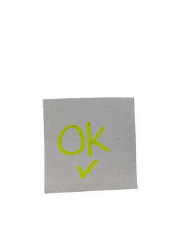 Green checkmark with okay text on torn paper