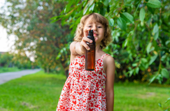Mosquito repellent spray outdoors. Selective focus.