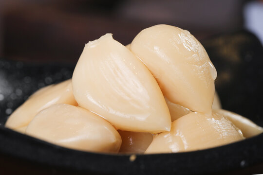 Fresh Peeled Garlic Cloves in Bowl Ready for Cooking