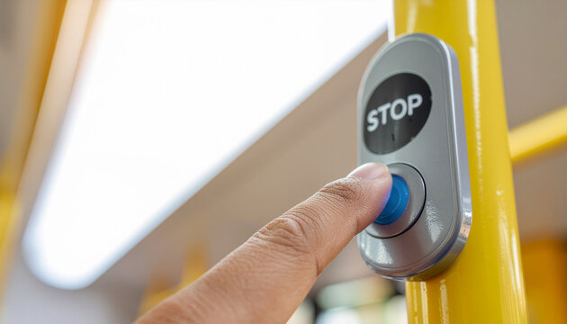 Close up of a passenger finger pressing a blue button next to a stop sign on a yellow pole inside a modern city bus, public transport and urban commuting concept video.