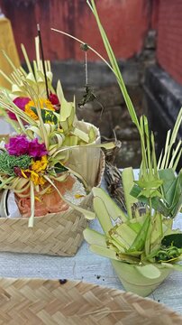 Balinese Canang Sari Traditional Offerings with Burning Incense