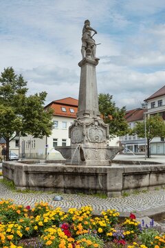 The town of Suhl Thuringia former German Democratic Republic. Fountain with a column and a statue of a Gunsmith