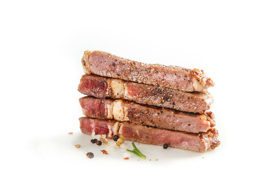 Thick Cut Grilled Beef Steaks Stack with Seasoning on White Background
